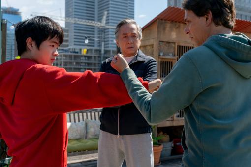 (L-R) Ben Wang, Jackie Chan & Ralph Macchio in Sony Pictures‘ KARATE KID: LEGENDS © 2024 CTMG, Inc. All Rights Reserved.
